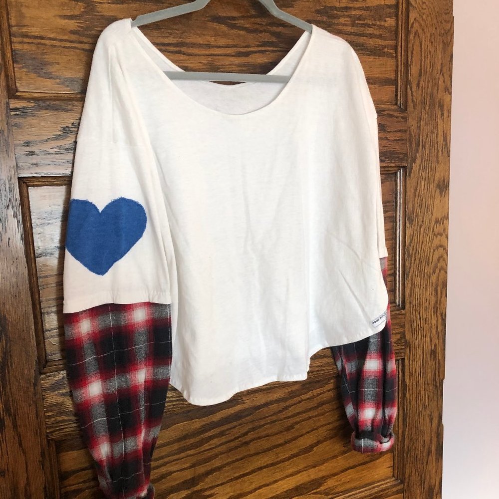 Poor Pitiful Pearl heart on sleeve